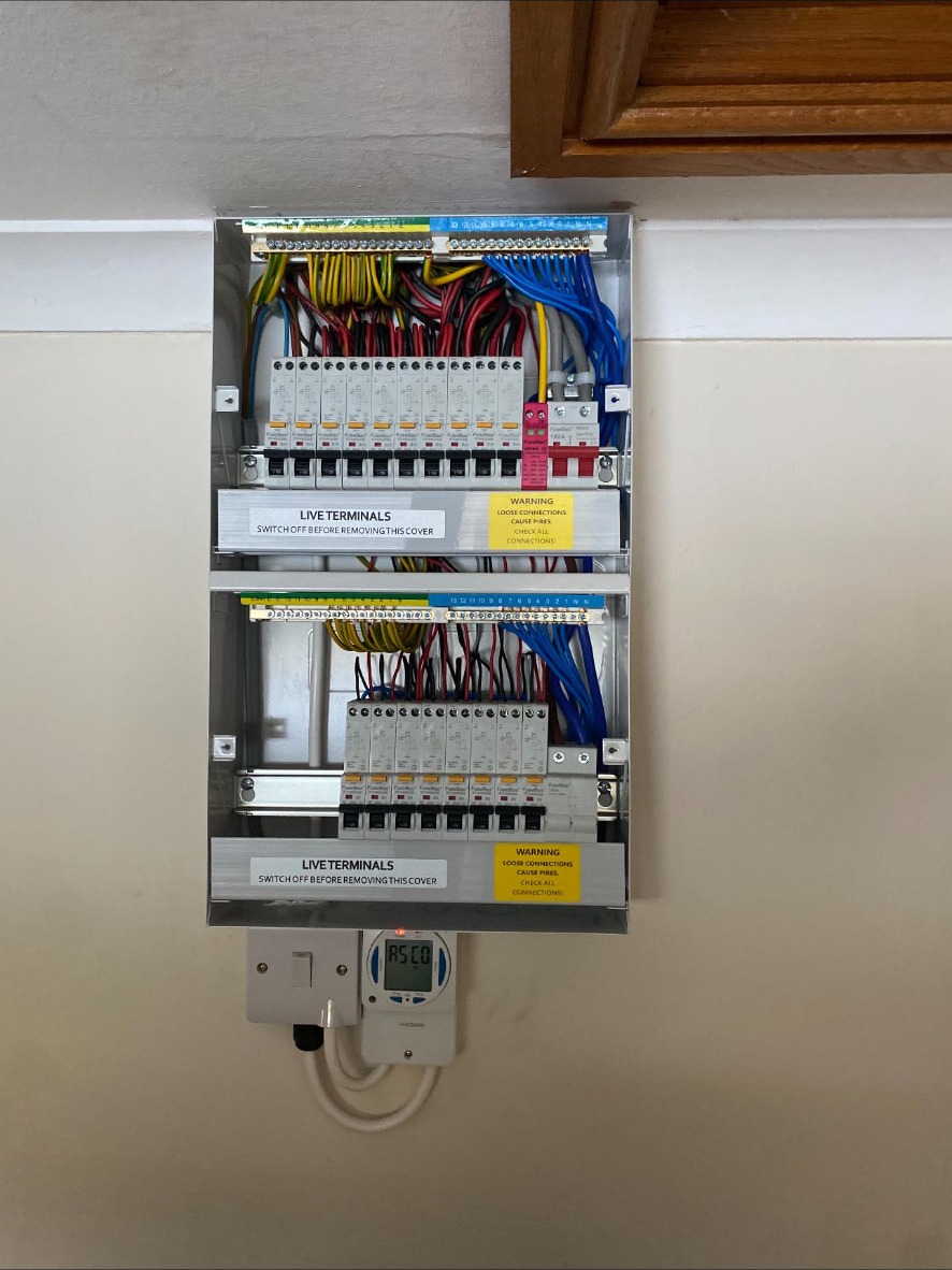New consumer unit and heating time clock installed together in a domestic property
