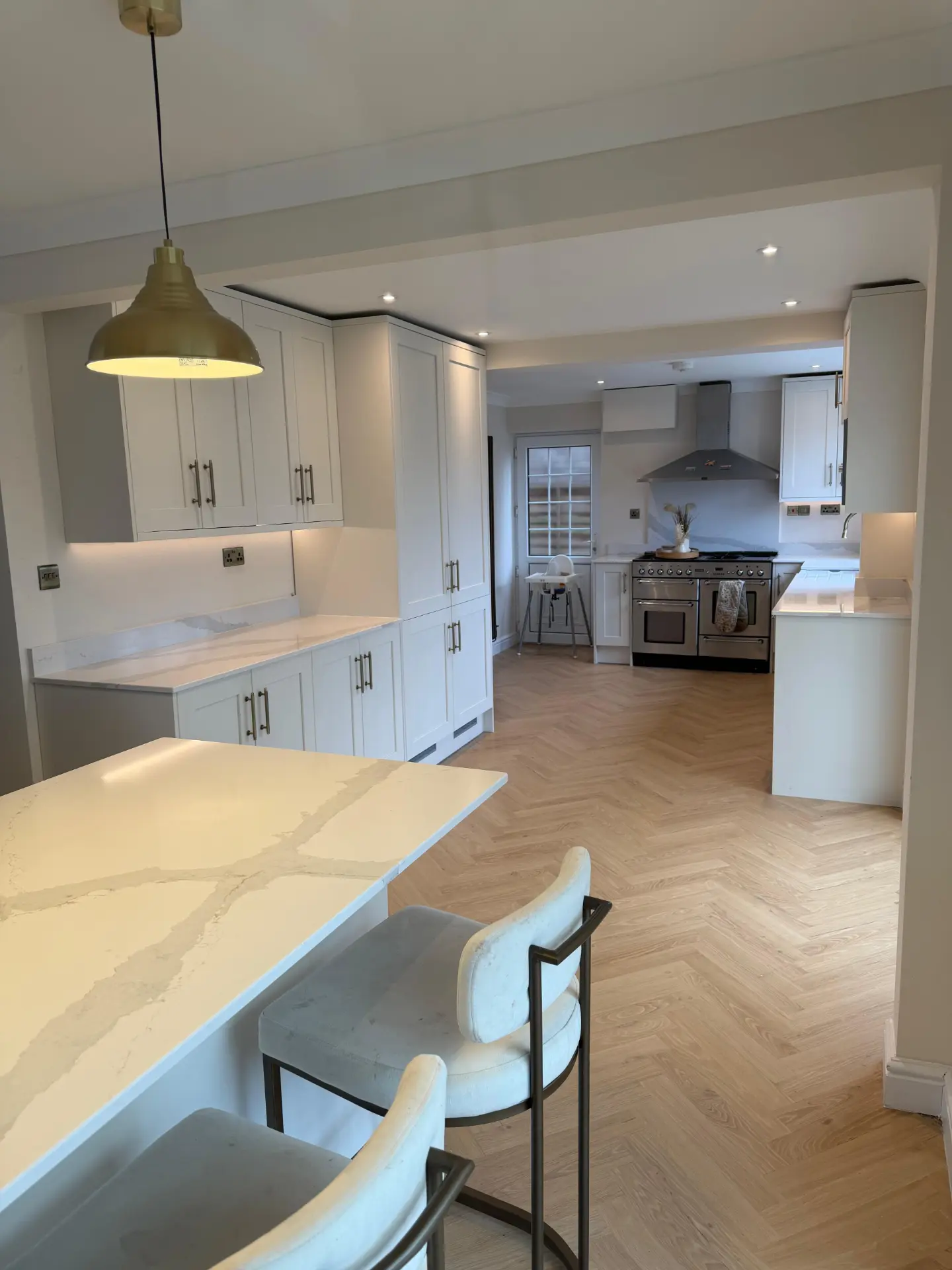 Newly built open plan kitchen with brass pendant lighting, downlights and new sockets installed by H&H Electrical Contractors