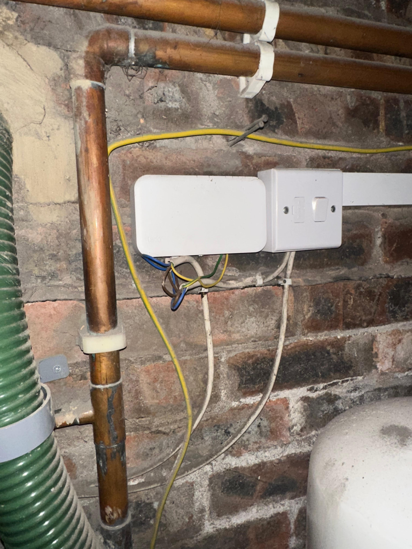 Tidy electrical distribution and conduit run mounted in a domestic basement rewire